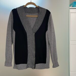 Ladies medium cardigan sweater with wrap front & silver zipper.